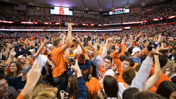 SYRACUSE, NY - OCTOBER 13: Syracuse Orange fans storm the field after the team upset Clemson Tigers at the Carrier Dome on October 13, 2017 in Syracuse, New York. Syracuse defeats Clemson 27-24. (Photo by Brett Carlsen/Getty Images)