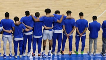 The Kentucky men's basketball team embraced during a moment of silence as they honored former walk-on Ben Jordan