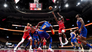TORONTO, ON - JANUARY 2: OG Anunoby #3 of the Toronto Raptors goes to the basket against RJ Barrett #9 of the New York Knicks (Photo by Mark Blinch/Getty Images)