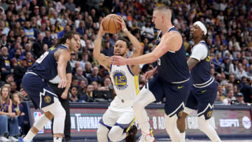 DENVER, COLORADO - NOVEMBER 08: Stephen Curry #30 of the Golden State Warriors drives against Nikola Jokic #15 of the Denver Nuggets in the first quarter at Ball Arena on November 08, 2023 in Denver, Colorado. NOTE TO USER: User expressly acknowledges and agrees that, by downloading and or using this photograph, User is consenting to the terms and conditions of the Getty Images License Agreement. (Photo by Matthew Stockman/Getty Images)