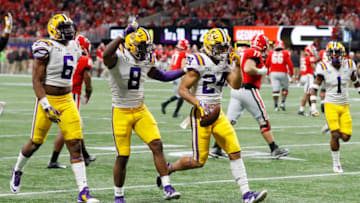 ATLANTA, GEORGIA - DECEMBER 07: Derek Stingley Jr. #24 of the LSU Tigers celebrates with teammates after intercepting a pass in the third quarter against the Georgia Bulldogs during the SEC Championship game at Mercedes-Benz Stadium on December 07, 2019 in Atlanta, Georgia. (Photo by Kevin C. Cox/Getty Images)