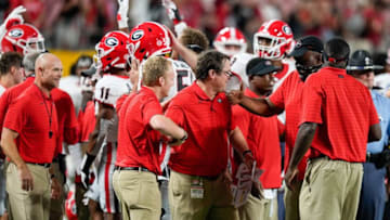 Sep 4, 2021; Charlotte, North Carolina, USA; Georgia Bulldogs Will Muschamp and other assistants celebrate the impending win during the second half against the Clemson Tigers at Bank of America Stadium. Mandatory Credit: Jim Dedmon-USA TODAY Sports