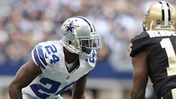 Dec 23, 2012; Arlington, TX, USA; Dallas Cowboys cornerback Morris Claiborne (24) defends against New Orleans Saints wide receiver Devery Henderson (19) at Cowboys Stadium. The Saints beat the Cowboys 34-31 in overtime. Mandatory Credit: Tim Heitman-USA TODAY Sports
