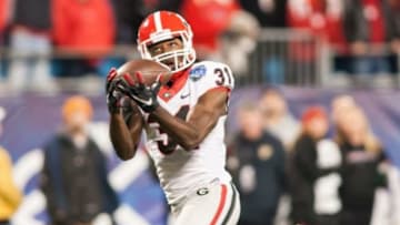Dec 30, 2014; Charlotte, NC, USA; Georgia Bulldogs wide receiver Chris Conley (31) catches a pass for a touchdown during the first quarter against the Louisville Cardinals of the Belk Bowl held at Bank of America Stadium. Credit: Jeremy Brevard-USA TODAY Sports
