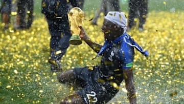 MOSCOW, RUSSIA - JULY 15: Benjamin Mendy of France celebrates with the World Cup Trophy following his sides victory in the 2018 FIFA World Cup Final between France and Croatia at Luzhniki Stadium on July 15, 2018 in Moscow, Russia. (Photo by Matthias Hangst/Getty Images)