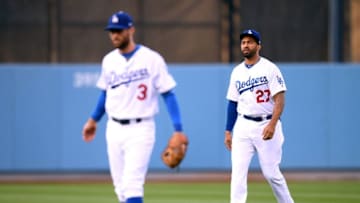 LOS ANGELES, CA - MAY 23: Matt Kemp #27 of the Los Angeles Dodgers warms up behind Chris Taylor #3 before the game against the Colorado Rockies at Dodger Stadium on May 23, 2018 in Los Angeles, California. (Photo by Harry How/Getty Images)