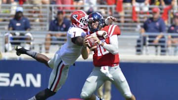 Sep 24, 2016; Oxford, MS, USA; Georgia Bulldogs linebacker Lorenzo Carter (7) hits Mississippi Rebels quarterback Chad Kelly (10) during the second quarter of the game at Vaught-Hemingway Stadium. Mandatory Credit: Matt Bush-USA TODAY Sports
