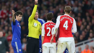 LONDON, ENGLAND - JANUARY 24: Referee Mark Clattenburg shows a red card to Per Mertesacker of Arsenal during the Barclays Premier League match between Arsenal and Chelsea at the Emirates Stadium on January 24, 2016 in London, England. (Photo by Catherine Ivill - AMA/Getty Images)