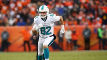 Nov 23, 2014; Denver, CO, USA; Miami Dolphins wide receiver Brian Hartline (82) during the game against the Denver Broncos at Sports Authority Field at Mile High. Mandatory Credit: Chris Humphreys-USA TODAY Sports