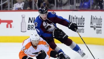 Mar 24, 2016; Denver, CO, USA; Philadelphia Flyers right wing Matt Read (24) battles for the puck with Colorado Avalanche defenseman Tyson Barrie (4) in the third period at the Pepsi Center. The Flyers won 4-2. Mandatory Credit: Ron Chenoy-USA TODAY Sports