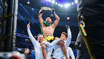 Jan 22, 2022; Anaheim, California, USA; Deiveson Figueiredo celebrates his win by unanimous decision against Brandon Moreno during UFC 270 at Honda Center. Mandatory Credit: Gary A. Vasquez-USA TODAY Sports