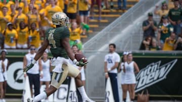 Sep 26, 2015; Waco, TX, USA; Baylor Bears wide receiver Jay Lee (4) scores a touchdown against the Rice Owls during the game at McLane Stadium. Mandatory Credit: Jerome Miron-USA TODAY Sports