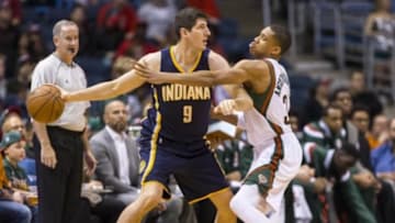Mar 26, 2015; Milwaukee, WI, USA; Indiana Pacers forward Damjan Rudez (9) holds the ball away from Milwaukee Bucks forward Giannis Antetokounmpo (34) during the first quarter at BMO Harris Bradley Center. Mandatory Credit: Jeff Hanisch-USA TODAY Sports