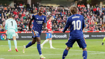 GRANADA, SPAIN - NOVEMBER 21: Vinicius Junior of Real Madrid celebrates 1-3 with Luka Modric of Real Madrid during the La Liga Santander match between Granada v Real Madrid at the Estadio Nuevo Los Carmenes on November 21, 2021 in Granada Spain (Photo by David S. Bustamante/Soccrates/Getty Images)