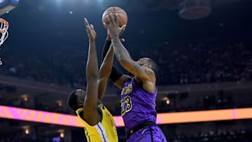 OAKLAND, CA - DECEMBER 25: LeBron James #23 of the Los Angeles Lakers goes up to shoot and gets fouled by Draymond Green #23 of the Golden State Warriors during the first half of their NBA Basketball game at ORACLE Arena on December 25, 2018 in Oakland, California. NOTE TO USER: User expressly acknowledges and agrees that, by downloading and or using this photograph, User is consenting to the terms and conditions of the Getty Images License Agreement. (Photo by Thearon W. Henderson/Getty Images)