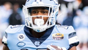 North Carolina Tar Heels running back Ty Chandler (19)takes the ball down the field while playing against South Carolina Gamecocks during the DukeÕs Mayo Bowl at Bank of America Stadium in Charlotte on Thursday, December 30, 2021.Jg Mayobowl 123021 036