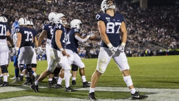 STATE COLLEGE, PA - SEPTEMBER 07: Pat Freiermuth #87 of the Penn State Nittany Lions celebrates after Noah Cain #21 of the Penn State Nittany Lions scores a touchdown against the Buffalo Bulls during the second half at Beaver Stadium on September 07, 2019 in State College, Pennsylvania. (Photo by Scott Taetsch/Getty Images)