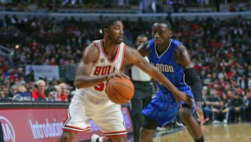 Nov 1, 2015; Chicago, IL, USA; Chicago Bulls guard E'Twaun Moore (55) moves against Orlando Magic guard Victor Oladipo (5) during the second half at the United Center. Chicago won 92-87. Mandatory Credit: Dennis Wierzbicki-USA TODAY Sports
