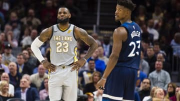 CLEVELAND, OH - FEBRUARY 7: LeBron James #23 of the Cleveland Cavaliers and Jimmy Butler #23 of the Minnesota Timberwolves joke with each other between plays during the first half at Quicken Loans Arena on February 7, 2018 in Cleveland, Ohio. The Cavaliers defeated the Timberwolves 140-138 in overtime. NOTE TO USER: User expressly acknowledges and agrees that, by downloading and or using this photograph, User is consenting to the terms and conditions of the Getty Images License Agreement. (Photo by Jason Miller/Getty Images)