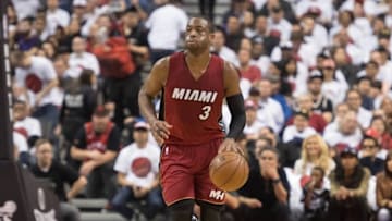 May 15, 2016; Toronto, Ontario, CAN; Miami Heat guard Dwyane Wade (3) dribbles the ball up court during the second quarter in game seven of the second round of the NBA Playoffs against the Toronto Raptors at Air Canada Centre. The Toronto Raptors won 116-89. Mandatory Credit: Nick Turchiaro-USA TODAY Sports