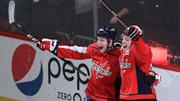 WASHINGTON, DC - JANUARY 5:Washington Capitals center Lars Eller (20) and Washington Capitals defenseman John Carlson (74) celebrate after Eller scored the winning goal during the overtime period of the game between the Washington Capitals and the San Jose Sharks at Capital One Arena on Sunday, January 5, 2020. The Washington Capitals defeated the San Jose Sharks 5-4 in overtime. (Photo by Toni L. Sandys/The Washington Post via Getty Images)