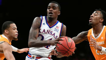 NEW YORK, NEW YORK - NOVEMBER 23: Lagerald Vick #24 of the Kansas Jayhawksdribbles past Tennessee Volunteers defense during the first half of the game at the NIT Season Tip-Off Tournament at Barclays Center on November 23, 2018 in the Brooklyn borough of New York City. (Photo by Sarah Stier/Getty Images)