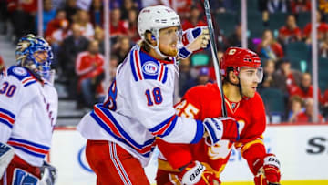 Nov 12, 2016; Calgary, Alberta, CAN; Calgary Flames center Freddie Hamilton (25) and New York Rangers defenseman Marc Staal (18) fight for position in front of New York Rangers goalie Henrik Lundqvist (30) during the second period at Scotiabank Saddledome. Mandatory Credit: Sergei Belski-USA TODAY Sports