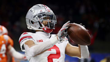 NEW ORLEANS, LOUISIANA - JANUARY 01: Chris Olave #2 of the Ohio State Buckeyes reacts after his touchdown catch against the Clemson Tigers in the third quarter during the College Football Playoff semifinal game at the Allstate Sugar Bowl at Mercedes-Benz Superdome on January 01, 2021 in New Orleans, Louisiana. (Photo by Chris Graythen/Getty Images)