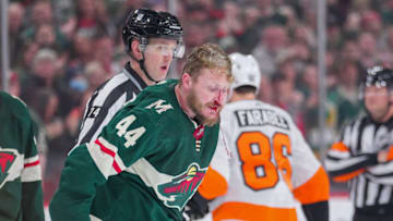 Mar 29, 2022; Saint Paul, Minnesota, USA; Minnesota Wild left wing Nicolas Deslauriers (44) is bloodied after his fight against the Philadelphia Flyers defenseman Nick Seeler (24) in the first period at Xcel Energy Center. Mandatory Credit: Brad Rempel-USA TODAY Sports