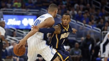 Oct 14, 2016; Orlando, FL, USA; Orlando Magic forward Aaron Gordon (00) passes the ball around Indiana Pacers guard Monta Ellis (11) during the second quarter at Amway Center. Mandatory Credit: Kim Klement-USA TODAY Sports