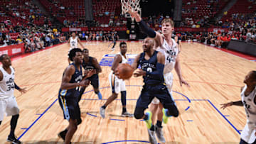 LAS VEGAS, NV - JULY 14: Jevon Carter #3 of the Memphis Grizzlies goes to the basket against the Utah Jazz during the 2018 Las Vegas Summer League on July 14, 2018 at the Thomas & Mack Center in Las Vegas, Nevada. NOTE TO USER: User expressly acknowledges and agrees that, by downloading and/or using this photograph, user is consenting to the terms and conditions of the Getty Images License Agreement. Mandatory Copyright Notice: Copyright 2018 NBAE (Photo by Garrett Ellwood/NBAE via Getty Images)