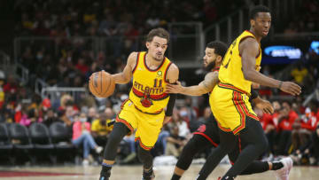 Feb 26, 2022; Atlanta, Georgia, USA; Atlanta Hawks guard Trae Young (11) dribbles past Toronto Raptors guard Fred VanVleet (23) as Hawks forward Onyeka Okongwu (17) sets a screen in the second half at State Farm Arena. Mandatory Credit: Brett Davis-USA TODAY Sports