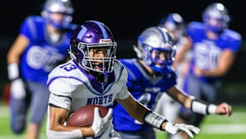 Waukesha North running back Chimere Dike (13) cuts outside during the game at Waukesha West on Thursday, Sept. 26, 2019.Mjs Wcn Football 9471