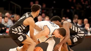 NEW YORK, NY - MARCH 09: Aaron Thompson #2 and Kamar Baldwin #3 of the Butler Bulldogs fight for the ball with Collin Gillespie #2 of the Villanova Wildcats in the second half during semifinals of the Big East Basketball Tournament at Madison Square Garden on March 9, 2018 in New York City. (Photo by Abbie Parr/Getty Images)