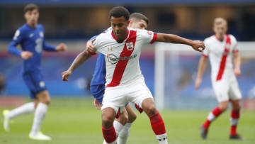 LONDON, ENGLAND - OCTOBER 17: Christian Pulisic of Chelsea and Ryan Bertrand of Southampton battle for the ball during the Premier League match between Chelsea and Southampton at Stamford Bridge on October 17, 2020 in London, England. Sporting stadiums around the UK remain under strict restrictions due to the Coronavirus Pandemic as Government social distancing laws prohibit fans inside venues resulting in games being played behind closed doors. (Photo by Matthew Childs - Pool/Getty Images)