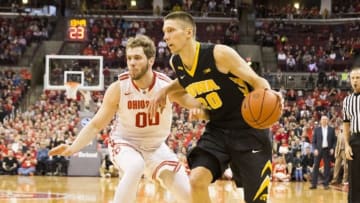 Feb 28, 2016; Columbus, OH, USA; Iowa Hawkeyes forward Jarrod Uthoff (20) drives past Ohio State Buckeyes forward Mickey Mitchell (00) at Value City Arena. Ohio State won the game 68-64. Mandatory Credit: Greg Bartram-USA TODAY Sports