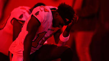 TAMPA, FLORIDA - JANUARY 16: Chris Godwin #14 of the Tampa Bay Buccaneers kneels on the field prior to a game against the Dallas Cowboys in the NFC Wild Card playoff game at Raymond James Stadium on January 16, 2023 in Tampa, Florida. (Photo by Julio Aguilar/Getty Images)