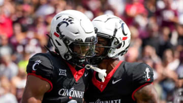 Cincinnati Bearcats wide receivers celebrate win over Eastern Kentucky at Nippert Stadium.