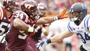 Oct 24, 2015; Blacksburg, VA, USA; Virginia Tech Hokies running back Travon McMillian (34) carries the ball as Duke Blue Devils linebacker Ben Humphreys (34) chases in the second quarter at Lane Stadium. Mandatory Credit: Geoff Burke-USA TODAY Sports