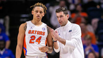 Florida Gators guard Riley Kugel (24) talks with Florida Gators head coach Todd Golden. The Florida Gators menÕs basketball team hosted the Florida Atlantic Owls at Billy Donovan Court at Exactech Arena in Gainesville, FL on Monday, November 14, 2022. The score was tied 35-35 at the half. [Doug Engle/Gainesville Sun]Gai Ufbasketballfau