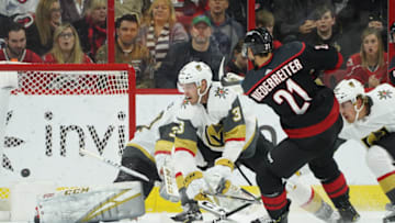 RALEIGH, NC - FEBRUARY 01: Carolina Hurricanes Left Wing Nino Niederreiter (21) scores past Vegas Golden Knights Defenceman Brayden McNabb (3) and Vegas Golden Knights Goalie Maxime Lagace (33) during a game between the Las Vegas Golden Knights and the Carolina Hurricanes at the PNC Arena in Raleigh, NC on February 1, 2019. (Photo by Greg Thompson/Icon Sportswire via Getty Images)