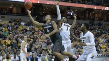 Jan 12, 2016; Columbia, MO, USA; Arkansas Razorbacks guard Jabril Durham (4) shoots a layup as Missouri Tigers guard Terrence Phillips (1) and forward D