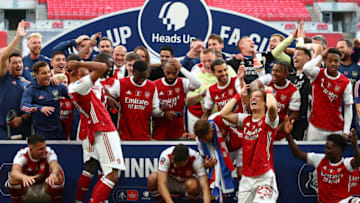 LONDON, ENGLAND - AUGUST 01: Players react as Pierre-Emerick Aubameyang of Arsenal drops the Fa Cup Trophy during the FA Cup Final match between Arsenal and Chelsea at Wembley Stadium on August 1, 2020 in London, England. Football Stadiums around Europe remain empty due to the Coronavirus Pandemic as Government social distancing laws prohibit fans inside venues resulting in all fixtures being played behind closed doors. (Photo by Marc Atkins/Getty Images)