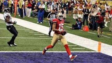 Feb 3, 2013; New Orleans, LA, USA; San Francisco 49ers wide receiver Michael Crabtree (15) scores a touchdown against the Baltimore Ravens in the third quarter in Super Bowl XLVII at the Mercedes-Benz Superdome. Mandatory Credit: Derick E. Hingle-USA TODAY Sports
