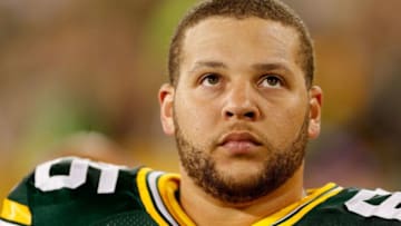 GREEN BAY, WI - SEPTEMBER 20: Guard Lane Taylor #65 of the Green Bay Packers on the sidelines during the NFL game against the Seattle Seahawks at Lambeau Field on September 20, 2015 in Green Bay, Wisconsin. The Packers defeated the Seahawks 27-17. (Photo by Christian Petersen/Getty Images)