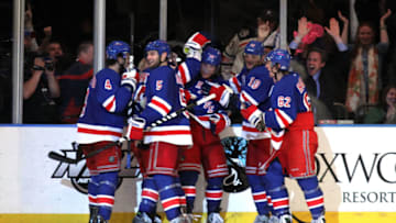 NEW YORK, NY - MAY 07: Brad Richards #19 of the New York Rangers celebrates with his teammates after scoring a goal to tie up the game late in the third period against Braden Holtby #70 of the Washington Capitals in Game Five of the Eastern Conference Semifinals during the 2012 NHL Stanley Cup Playoffs at Madison Square Garden on May 7, 2012 in New York City. (Photo by Bruce Bennett/Getty Images)