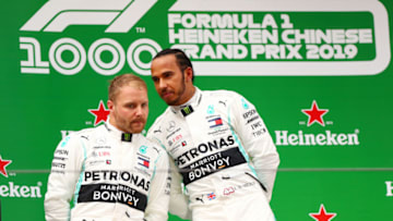 SHANGHAI, CHINA - APRIL 14: Race winner Lewis Hamilton of Great Britain and Mercedes GP and second placed finisher Valtteri Bottas of Finland and Mercedes GP celebrate on the podium during the F1 Grand Prix of China at Shanghai International Circuit on April 14, 2019 in Shanghai, China. (Photo by Dan Istitene/Getty Images)