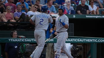 Jul 30, 2016; Arlington, TX, USA; Kansas City Royals shortstop Alcides Escobar (2) and third base coach Mike Jirschele (23) celebrate Escobar