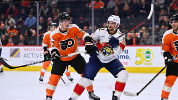Mar 21, 2023; Philadelphia, Pennsylvania, USA; Philadelphia Flyers right wing Wade Allison (57) defends Florida Panthers center Eric Staal (12) in the second period at Wells Fargo Center. Mandatory Credit: Kyle Ross-USA TODAY Sports
