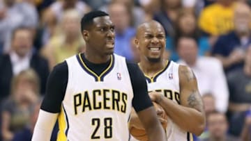 May 7, 2014; Indianapolis, IN, USA; Indiana Pacers forward David West (21) and center Ian Mahinmi (28) react to the Pacers being called for a 24 second shot violation while playing against the Washington Wizards in game two of the second round of the 2014 NBA Playoffs at Bankers Life Fieldhouse. Mandatory Credit: Brian Spurlock-USA TODAY Sports